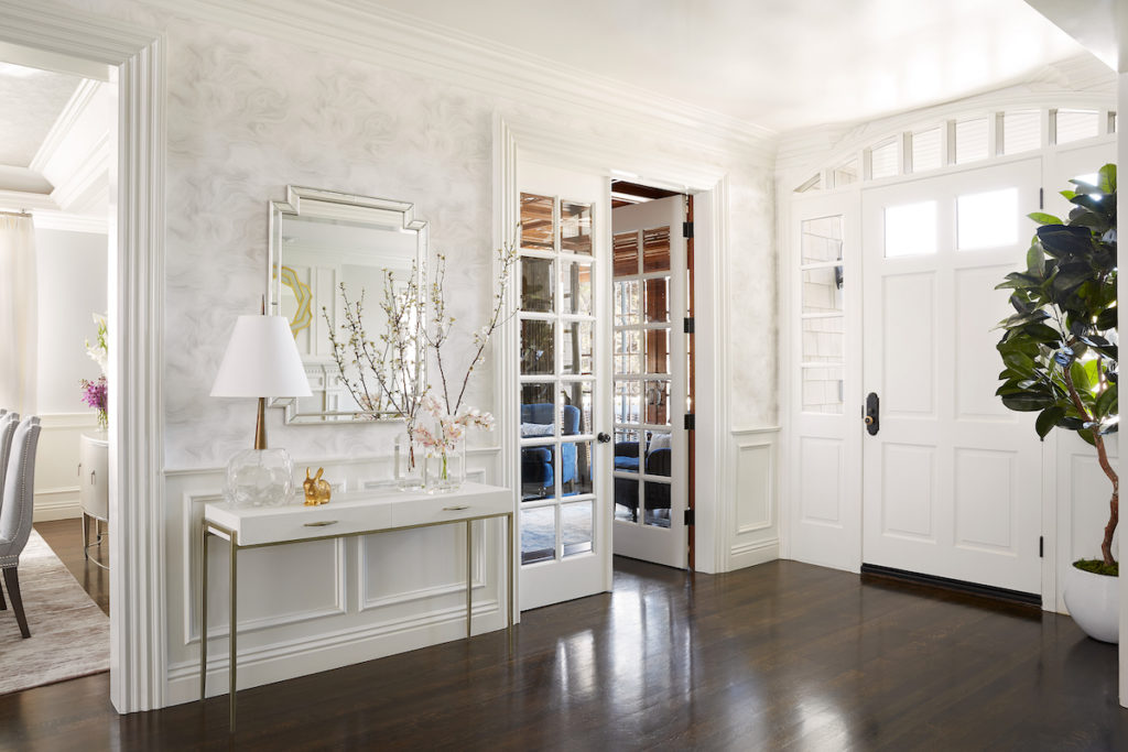 White theme entry door wall design with dressing table